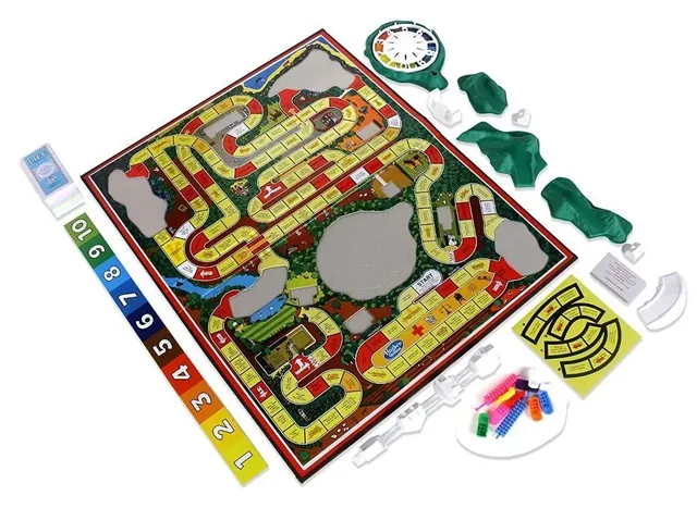 The board and its 3-D pieces, spinner, cars and pegs before set-up