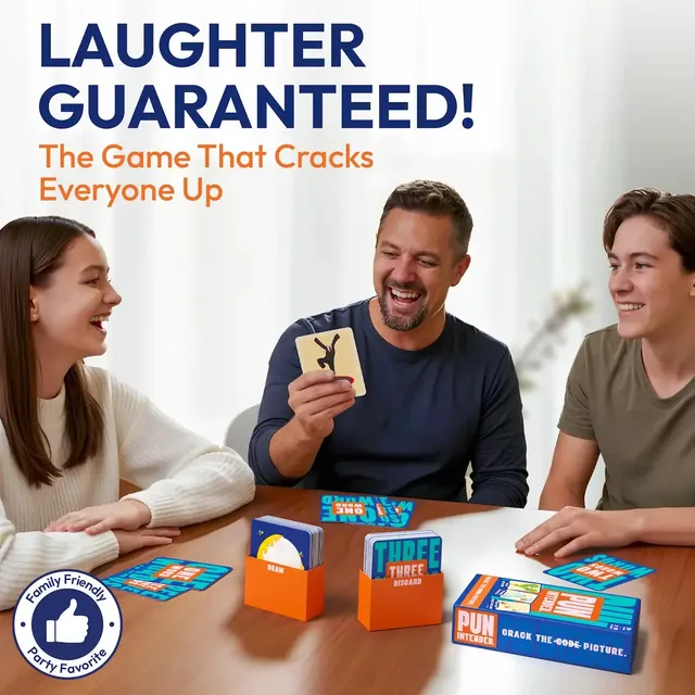 A father and two teenagers laughing over a picture card at a table