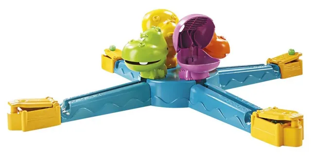 The assembled game: four hippos in the middle of a blue base, with a ramp and a yellow launcher reaching out to each side