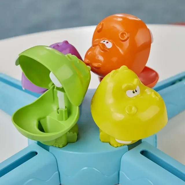 Green, orange and yellow hippos with their mouths opening and closing