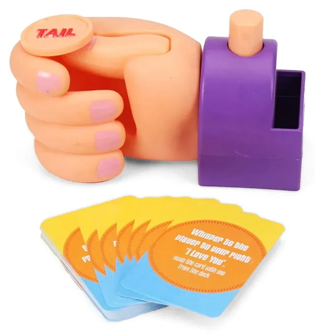 The purple push-button coin flipper shaped like a hand, with the coin and a fan of challenge cards