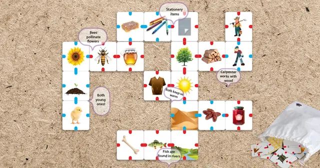 A grid of picture tiles laid out on a table beside the cloth bag
