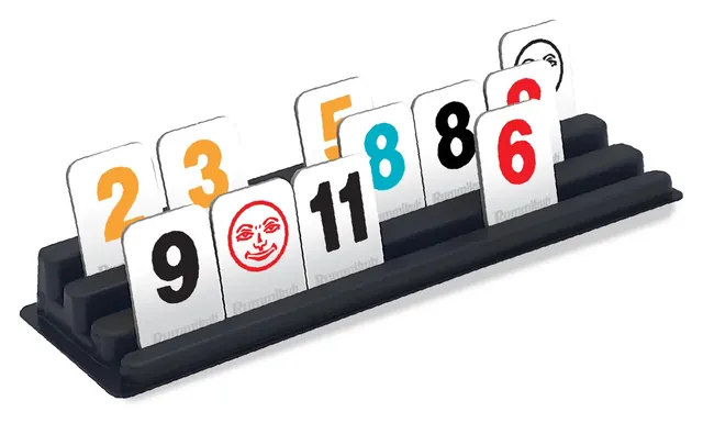 A black rack holding cardboard tiles numbered 2, 3, 5, 9, 11, 8 and 6 and a joker