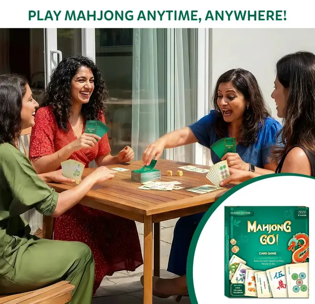 Three women laughing over a game of Mahjong Go! at an outdoor table
