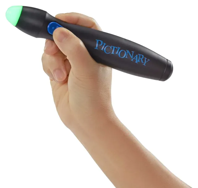 A hand holding the black Pictionary Air pen, its tip lit green