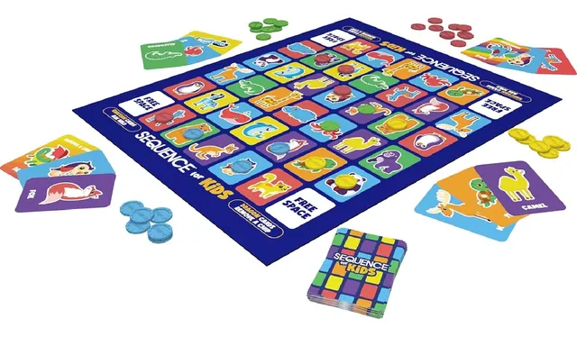 The Sequence for Kids board at an angle with animal cards and blue, red, green and yellow chips around it