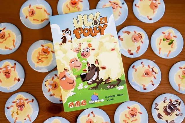 The box lying on round sheep tiles with funny faces