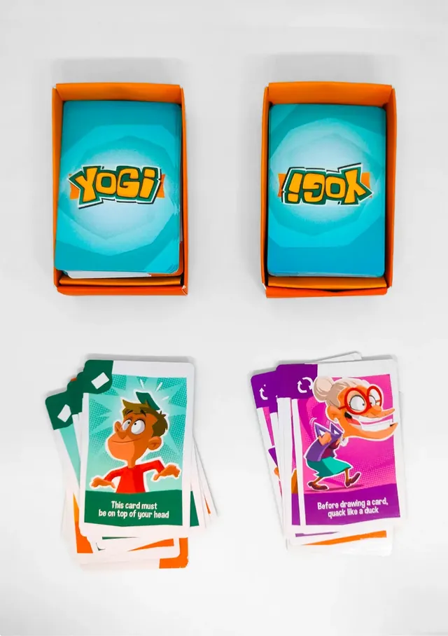 Two card holders with draw piles and two hands of instruction cards