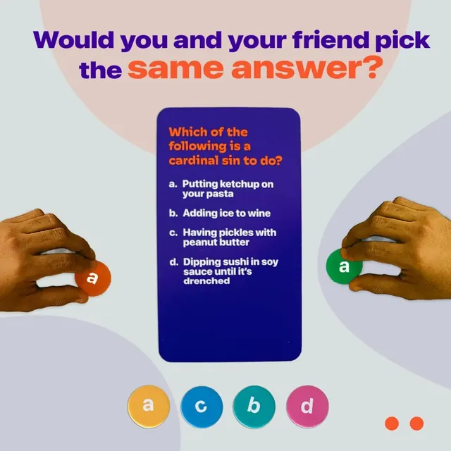 A question card with answers a to d and two hands holding answer tokens