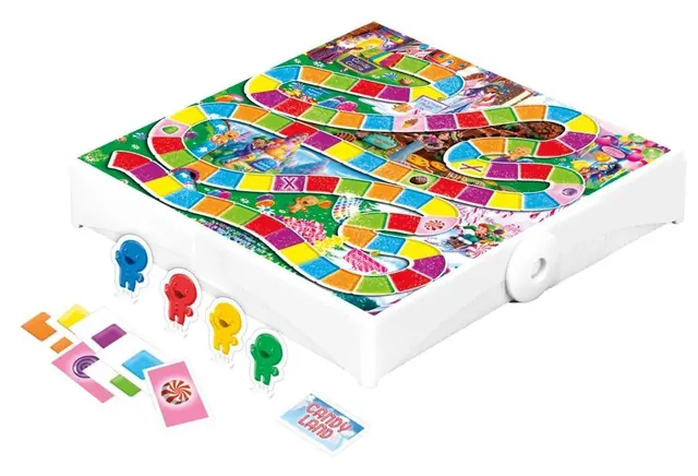 The open white travel case with the rainbow Candy Land path, four coloured gingerbread movers and cards
