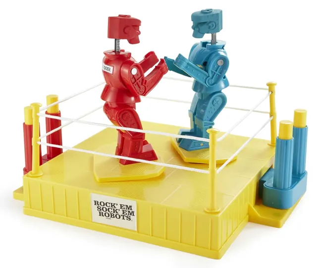 The ring from the side, with Red Rocker and Blue Bomber trading punches