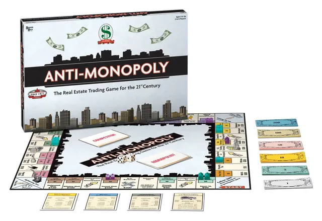 The Anti-Monopoly box with the board, title deed cards and paper money laid out in front