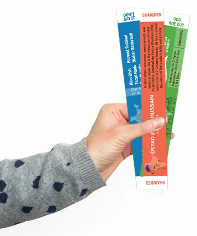 A hand holding three Discover India sticks