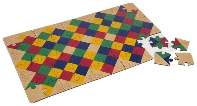 A long jigsaw of coloured diamonds being finished, with a few loose pieces at one end