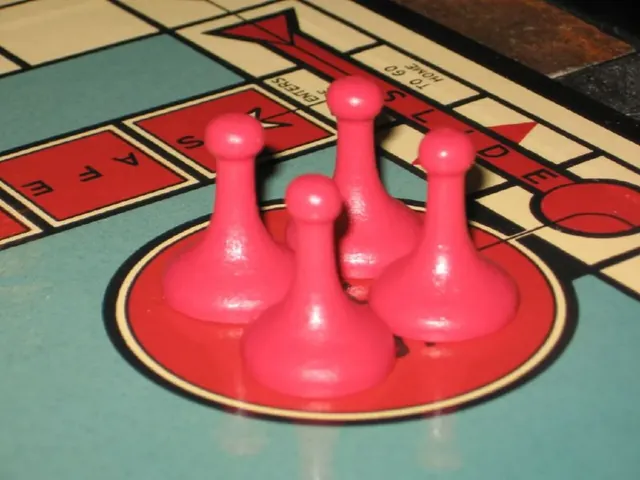 Four pink Sorry! pawns waiting on a Start space of a full-size board