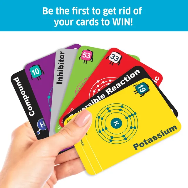 A hand holding a fan of cards, including Potassium, a Reversible Reaction card and an Inhibitor