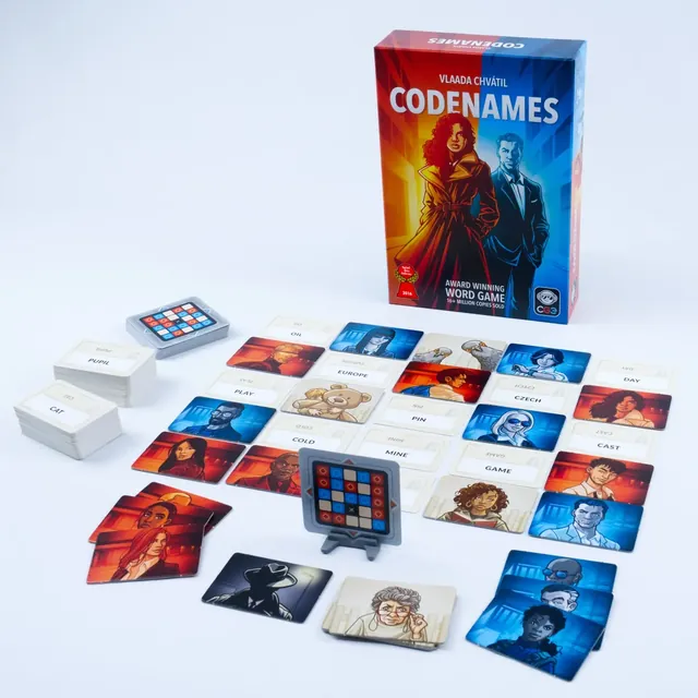 The 2025 Codenames box with word cards in a grid, agent cards, the key card stand and the timer