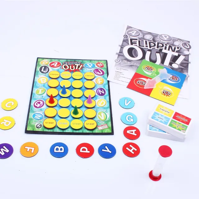 The Flippin Out board with yellow spaces and pawns, letter chips, category cards, the rules and a red sand timer