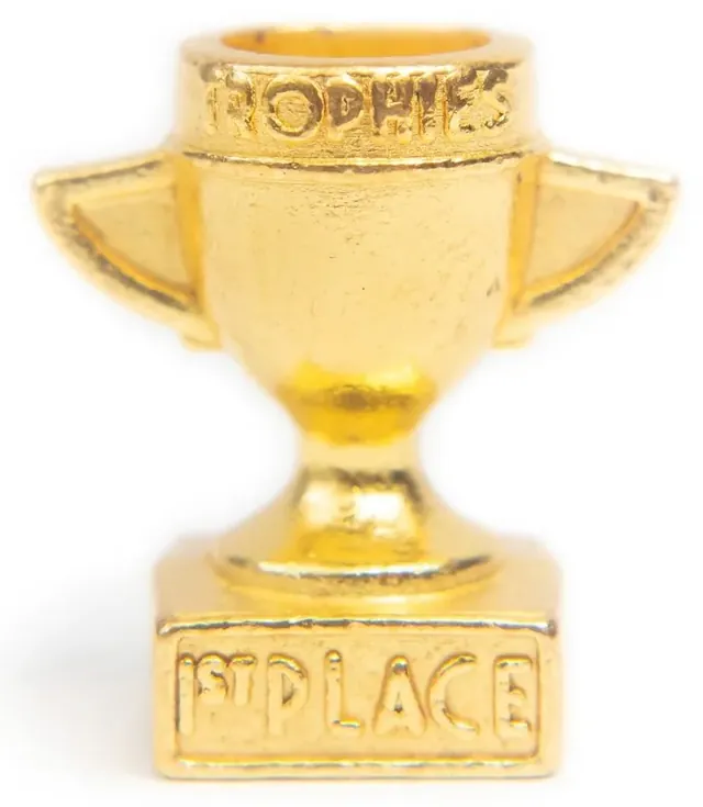The tiny gold metal trophy close up