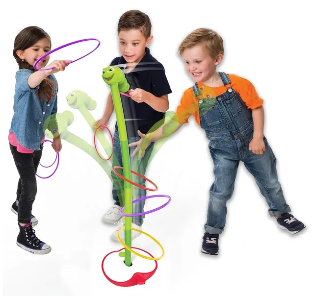 Three children tossing rings at the swaying worm