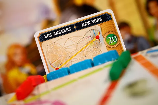 A Los Angeles to New York ticket worth 20 points standing on the board