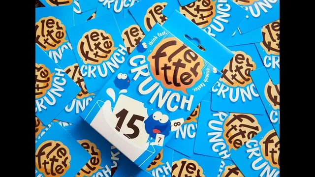 The Fletter Crunch box on a spread of blue cards, from Binca's video