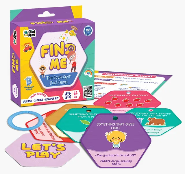The box beside its instruction sheet, the clip and hexagonal hunt cards such as 'Something that gives light'