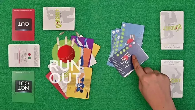 A finger pointing at cards on a green table, with the words 'Run out' over the picture (still from Binca's video)