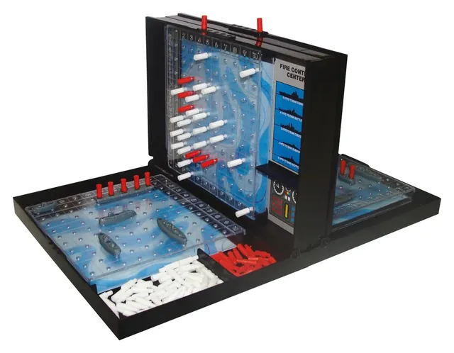 An open black Battleship case with its target grid, ocean grid, ships and red and white pegs