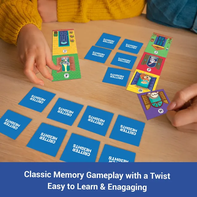 A child's hands turning over face-down blue tokens beside a growing tower of floors
