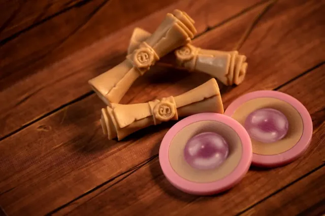 Two privilege scrolls and two pink pearl tokens on a wooden table