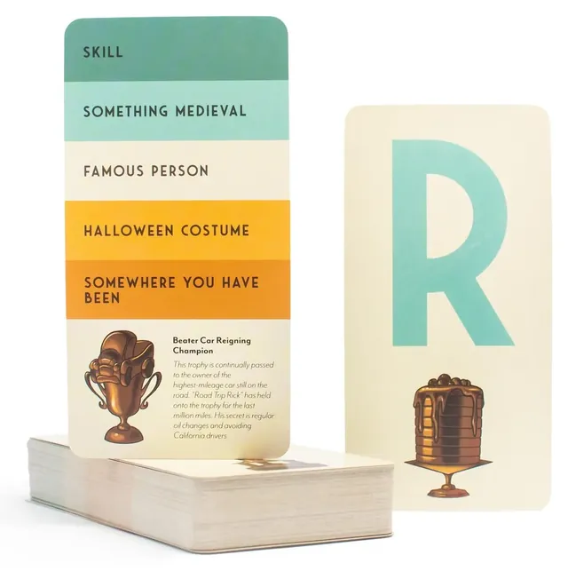 A topic card with Skill, Famous person and Halloween costume beside a letter R card