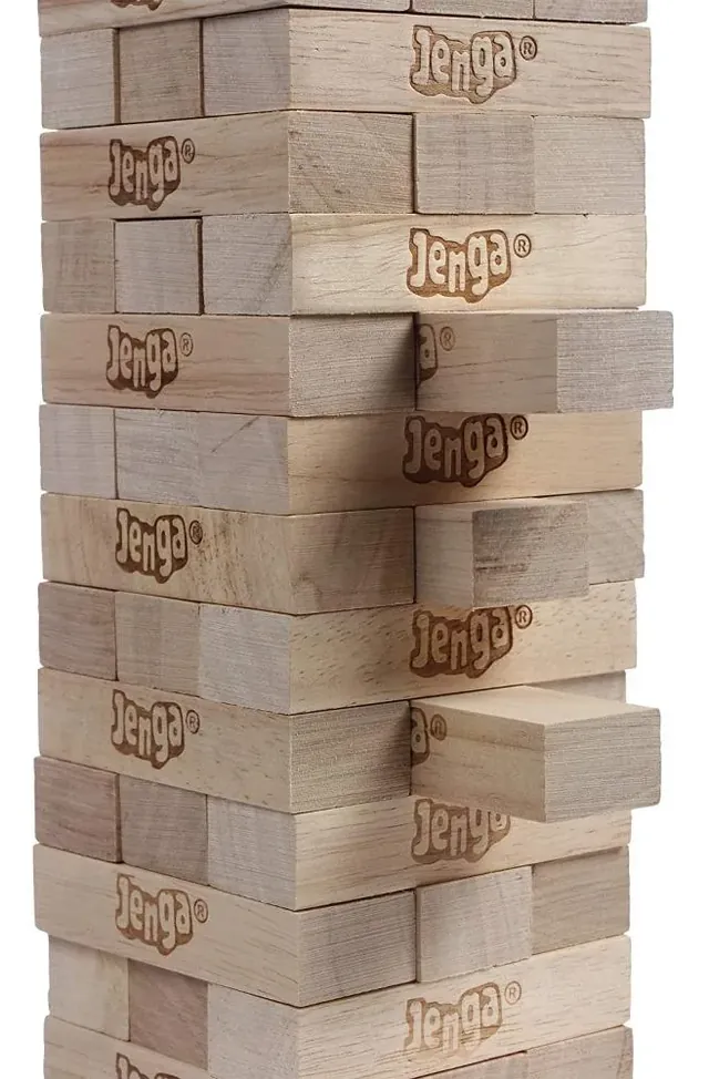 A close view of Jenga blocks sticking out of the tower