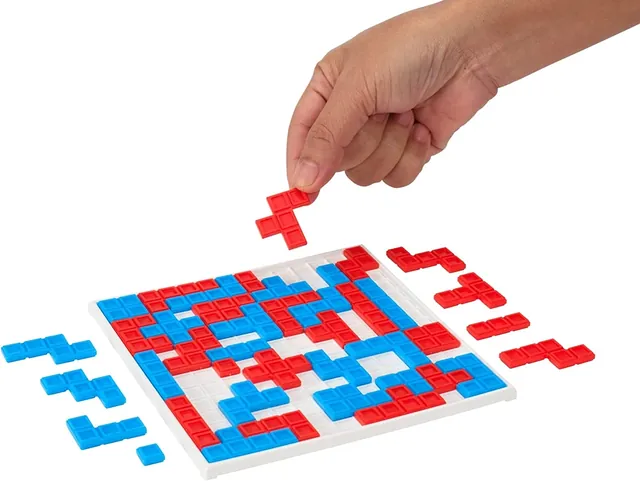 Red and blue Blokus Fast Fun pieces on a small square board
