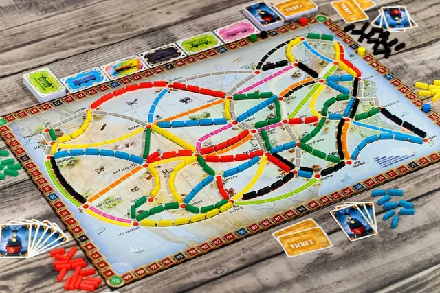The USA map from above during a game, with coloured train routes claimed across the country