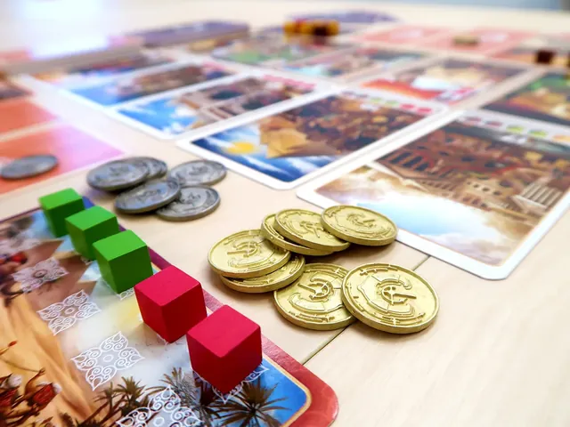 Gold and silver coins and green and red spice cubes on a card