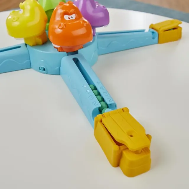 A yellow launcher at the end of a blue ramp, with melons collected in the ramp's counter