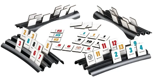 Four black racks holding cardboard number tiles, with more tiles laid out between them