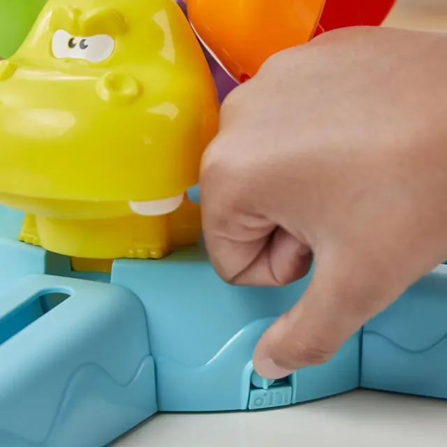 A finger moving the switch on the base