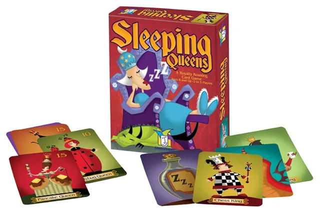 The Sleeping Queens box with queen, king and number cards spread in front