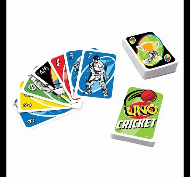 A fan of UNO Cricket cards with cricketers on them, beside the card pile and the green pack