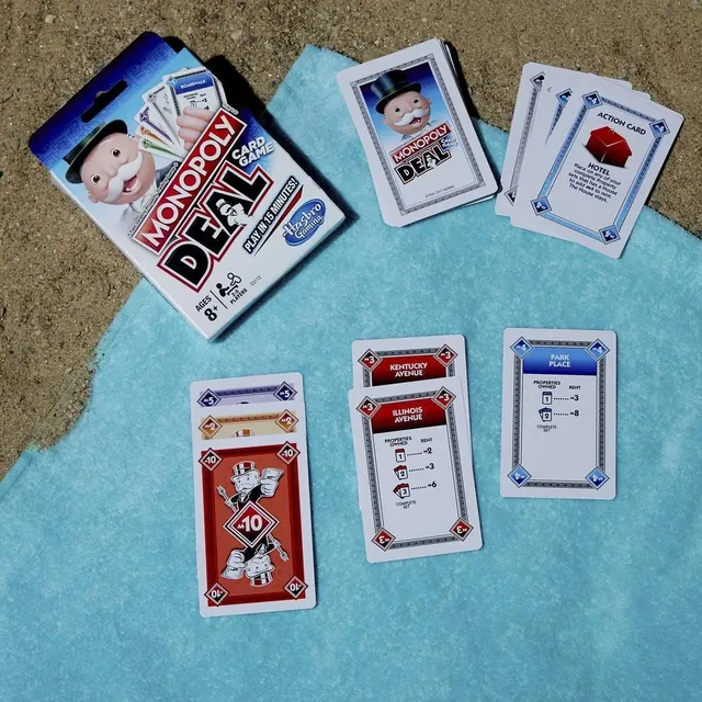 Property, rent and action cards spread on a towel (English pack shown)