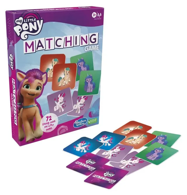 The box with pony picture cards laid out in front of it