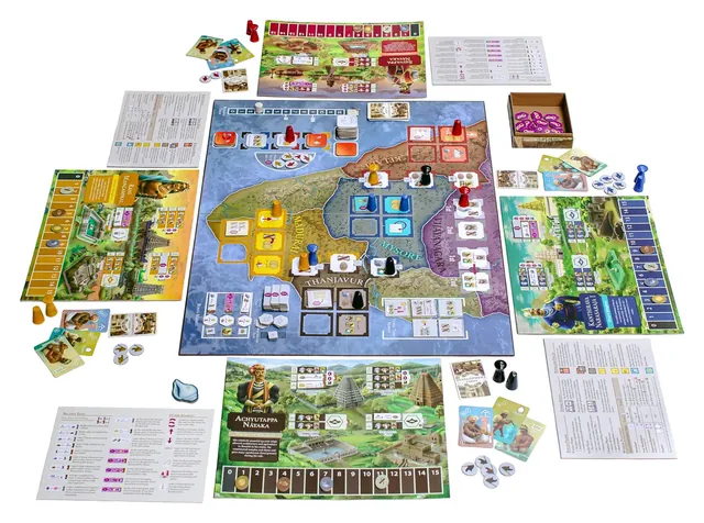 Everything in the box laid out: the map of southern India, four player boards, cards, tiles and wooden pawns