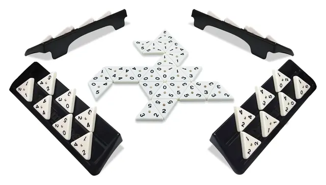 Four black tile racks holding white triangular tiles, with more tiles joined in the middle