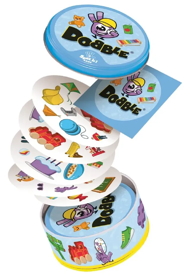 A stack of round Dobble Kids cards rising out of the open tin