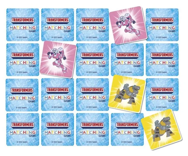 Picture cards face down in rows, with a few Transformers cards turned over